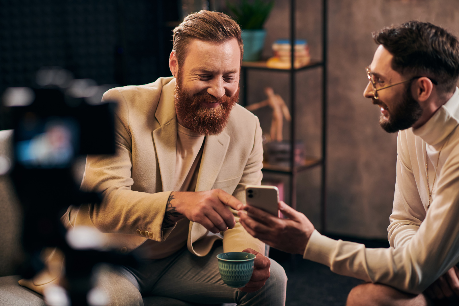 Male being interviewed by a market researcher with smart phone using the NestForms mobile survey app